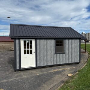 10X16 METAL BOARD & BATON CABIN/ SOLD